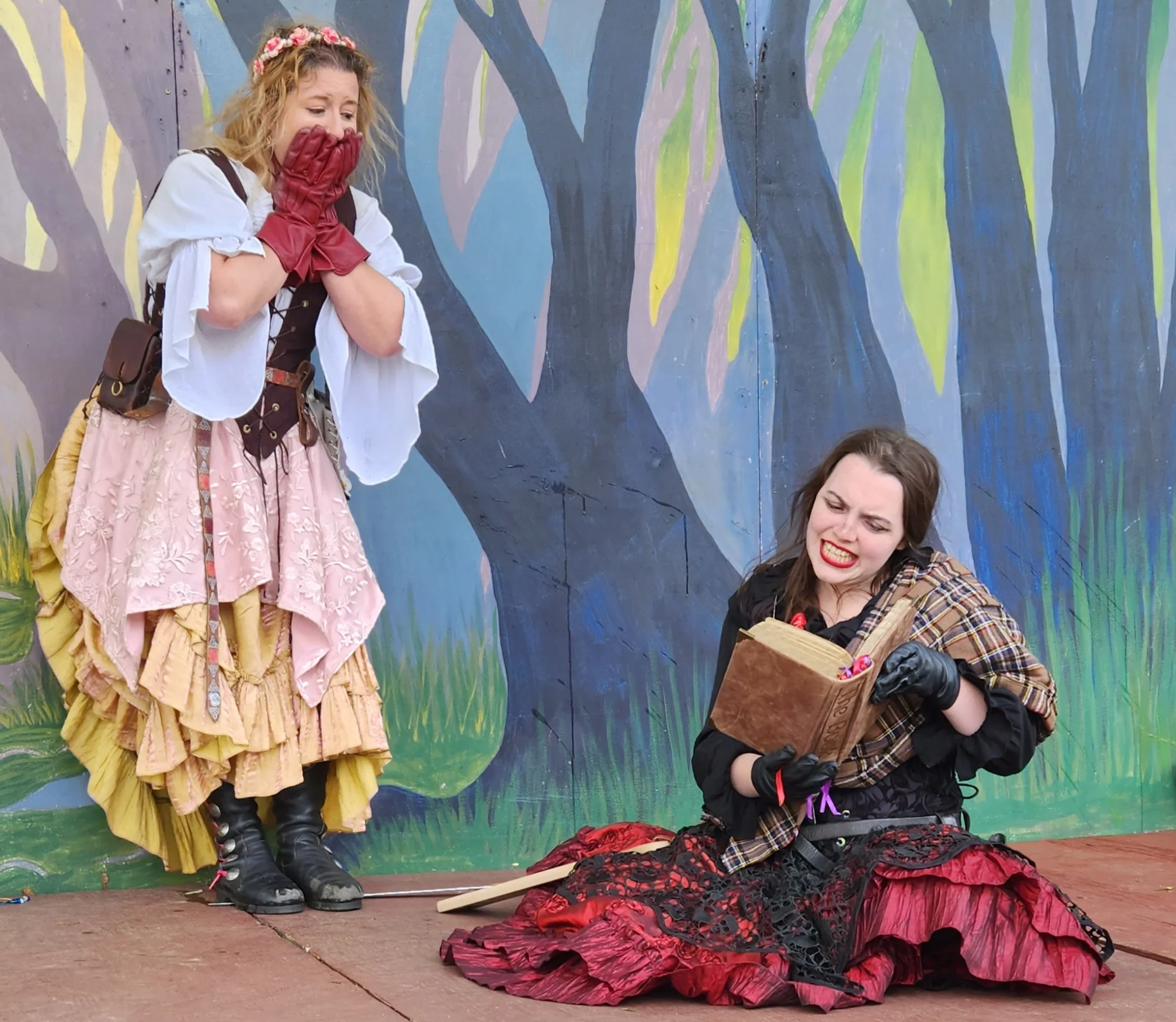 Sisters Pendragon reading to audience